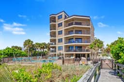 Contemporary gem on the Gulf Coast with balcony and WD walk to beach and shops