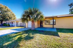 Single story home near beach with heated private pool enclosed yard Dogs ok