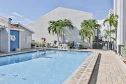 Water view condo with balcony heated pool and WD walk to beach - Image 2