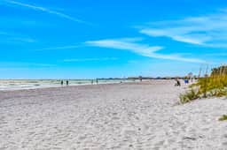 Charming Gulf front condo with balcony full kitchen central AC and WD