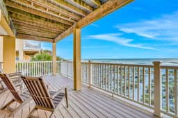 Charming Gulf front condo with balcony full kitchen central AC and WD