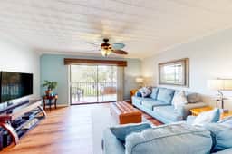 Beachfront condo with balconies grill AC and pool access steps from the sand