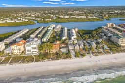 Beachfront condo with balconies grill AC and pool access steps from the sand - Image 2