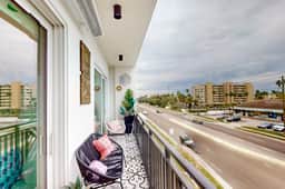 Sunlit and colorful beach condo with heated pool hot tub and balcony near shore and shops - Image 2