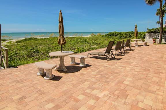 Elegant 1st floor condo w private patio AC on site outdoor pool and gas grills