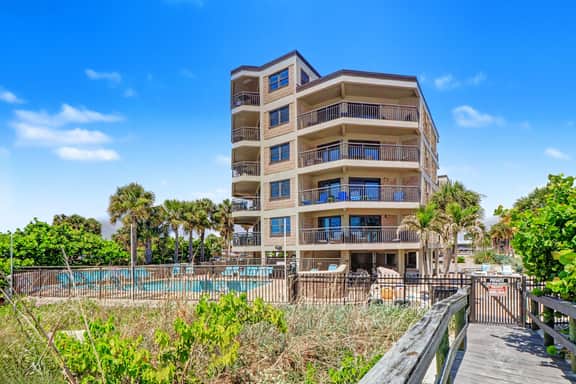 Contemporary gem on the Gulf Coast with balcony and WD walk to beach and shops