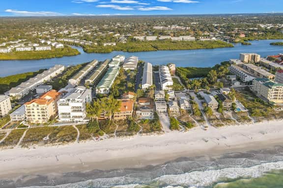 Beachfront condo with balconies grill AC and pool access steps from the sand - Image 2