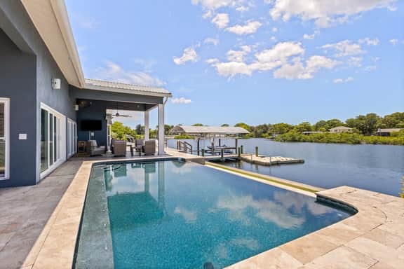 Modern indulgence with media room expansive waterway views AC WD and Wifi