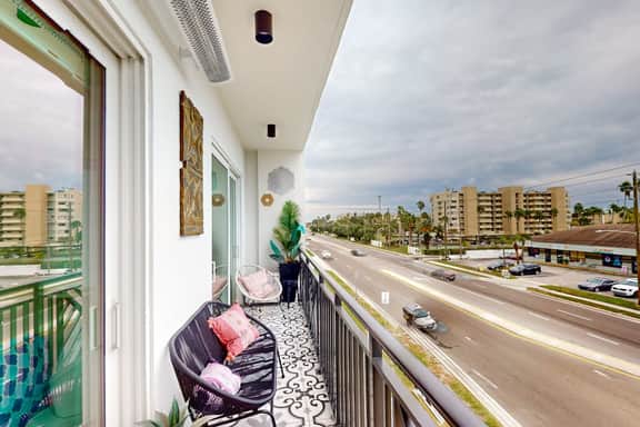 Sunlit and colorful beach condo with heated pool hot tub and balcony near shore and shops - Image 2