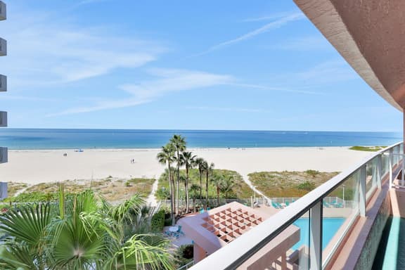 Beachfront condo with multiple balconies heated pool gym hot tub and AC