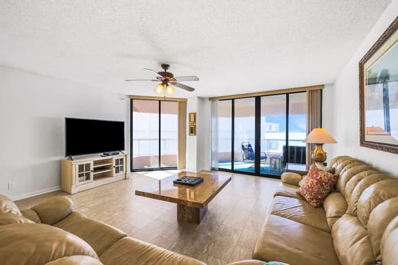 Beachfront condo with multiple balconies heated pool gym hot tub and AC - Image 1
