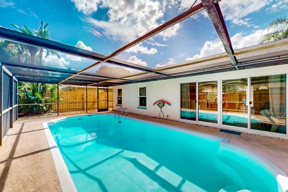Coastal home with pool lanai patio and fireplace - Image 1