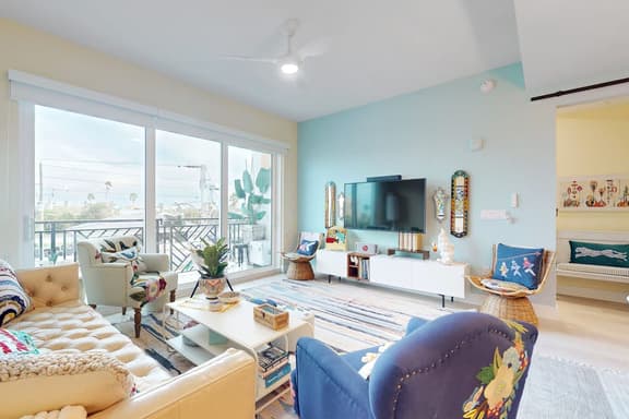 Sunlit and colorful beach condo with heated pool hot tub and balcony near shore and shops - Image 1